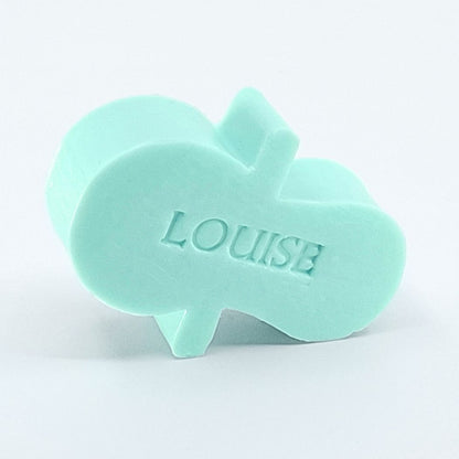 Gepersonaliseerd zeepje met naam in de vorm van een fopspeen in de kleur muguet